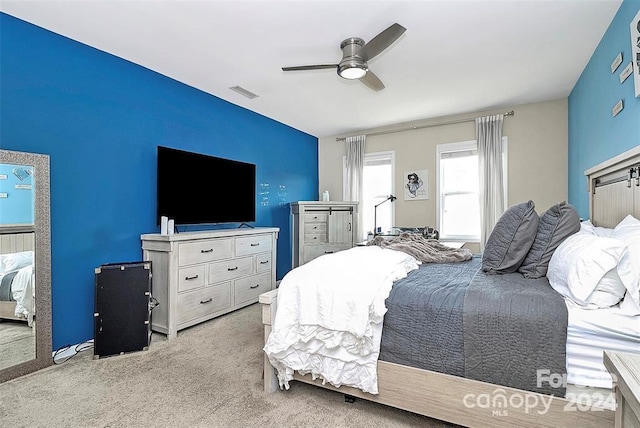 carpeted bedroom featuring ceiling fan