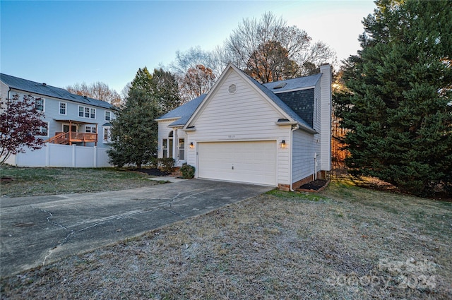 exterior space with a front lawn and a garage