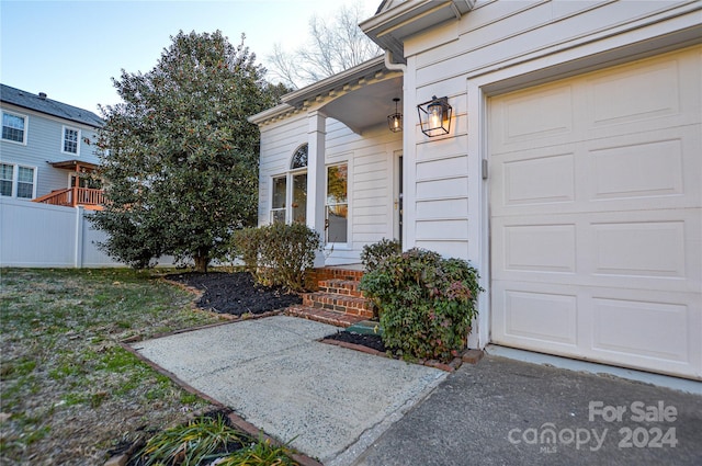 entrance to property featuring a garage