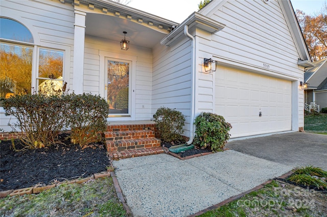 entrance to property featuring a garage