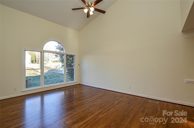 spare room featuring ceiling fan, dark hardwood / wood-style flooring, and high vaulted ceiling