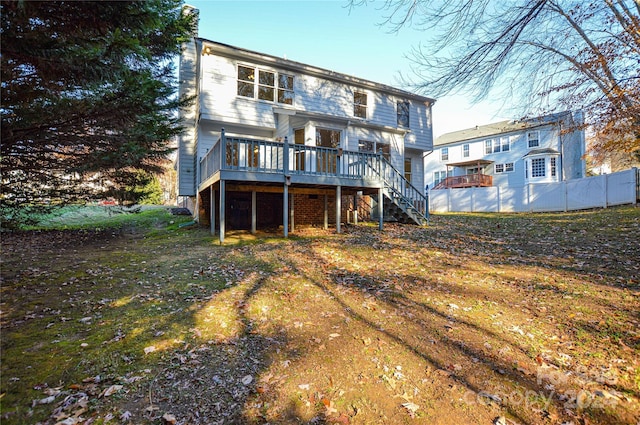 rear view of house with a wooden deck