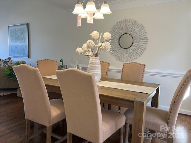 dining area featuring dark hardwood / wood-style flooring and a notable chandelier