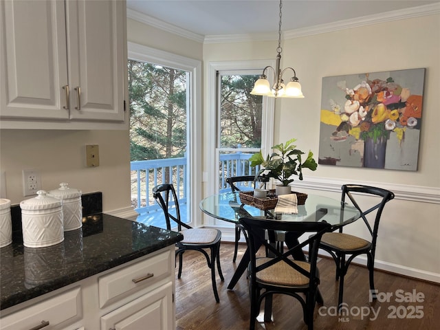 dining area with crown molding, a healthy amount of sunlight, a chandelier, and dark wood-type flooring