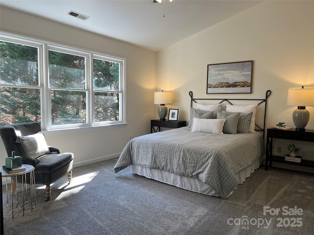 carpeted bedroom featuring vaulted ceiling