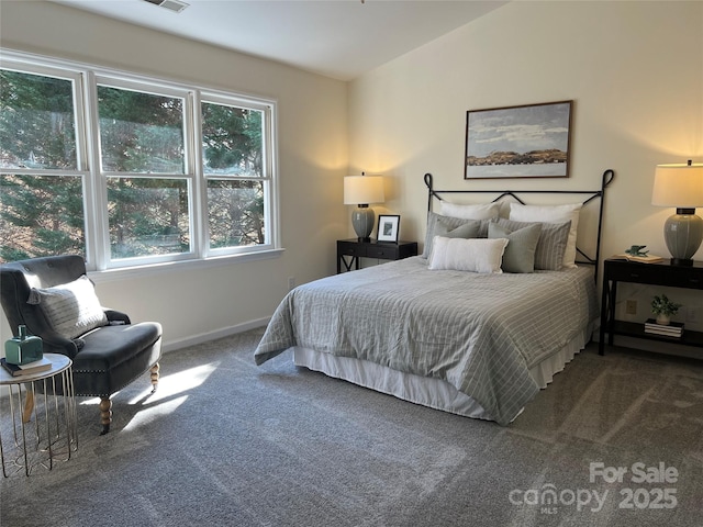 bedroom featuring vaulted ceiling and carpet flooring