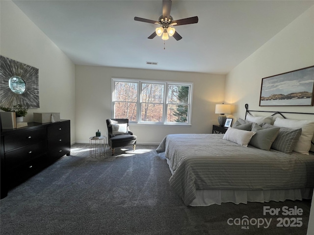 bedroom featuring lofted ceiling, carpet flooring, and ceiling fan