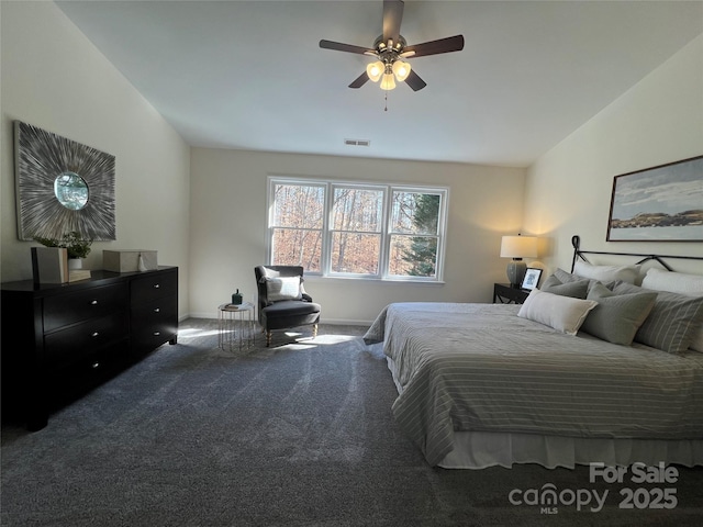 bedroom with carpet floors, ceiling fan, and vaulted ceiling