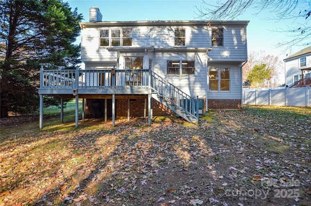 back of property with a wooden deck