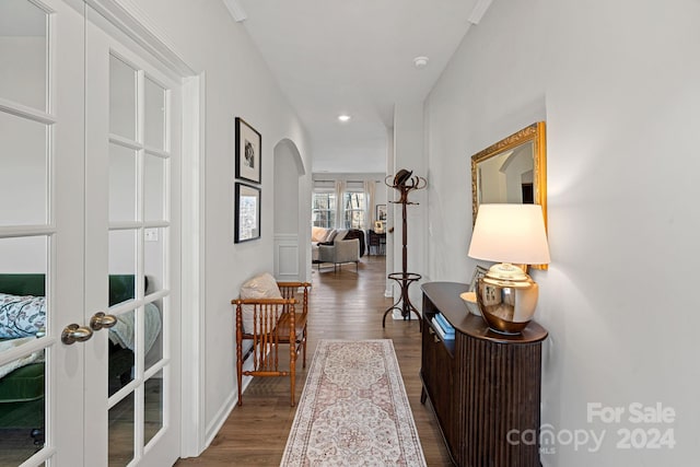 corridor featuring hardwood / wood-style floors and french doors