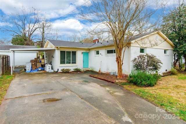 ranch-style home with a carport