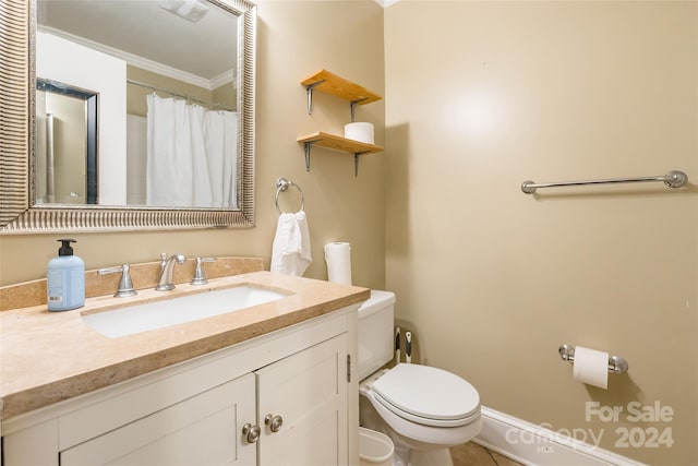 bathroom with curtained shower, tile patterned floors, toilet, vanity, and ornamental molding