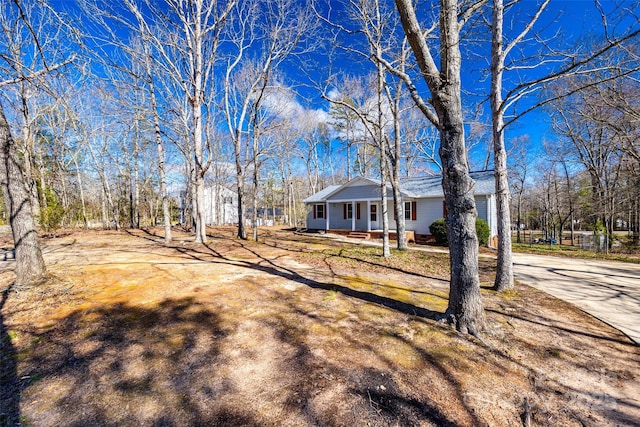 exterior space with concrete driveway