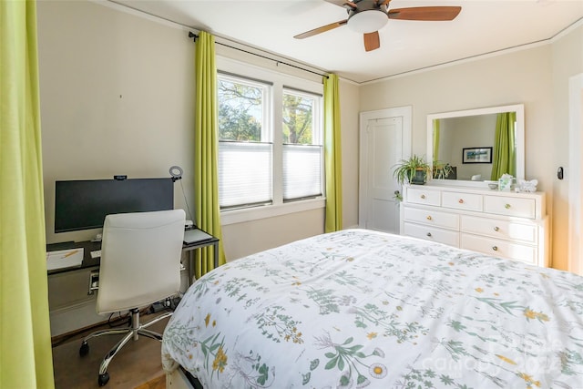 bedroom featuring ceiling fan and ornamental molding