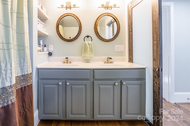 bathroom featuring vanity and hardwood / wood-style flooring