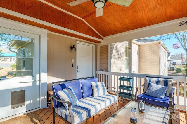 sunroom featuring wood ceiling, ceiling fan, lofted ceiling, and a wealth of natural light