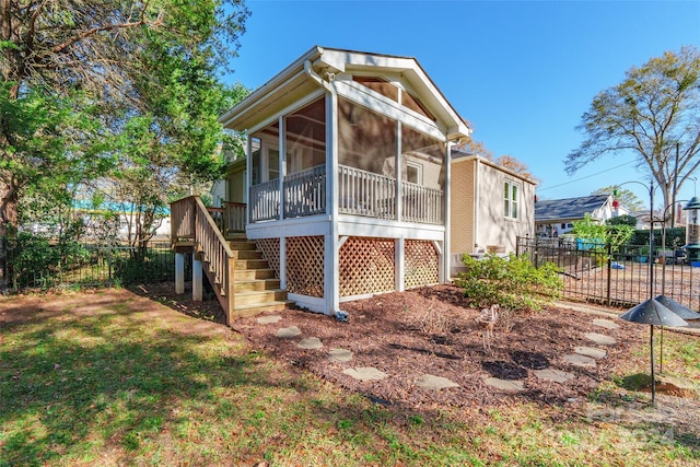 rear view of house with a sunroom