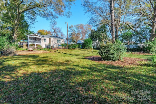 view of yard featuring a sunroom