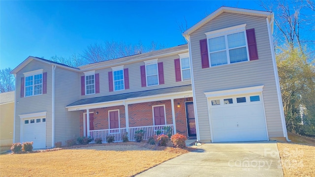 view of front of house featuring a porch and a garage