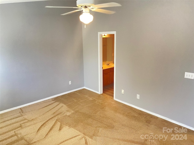 spare room featuring carpet flooring and ceiling fan