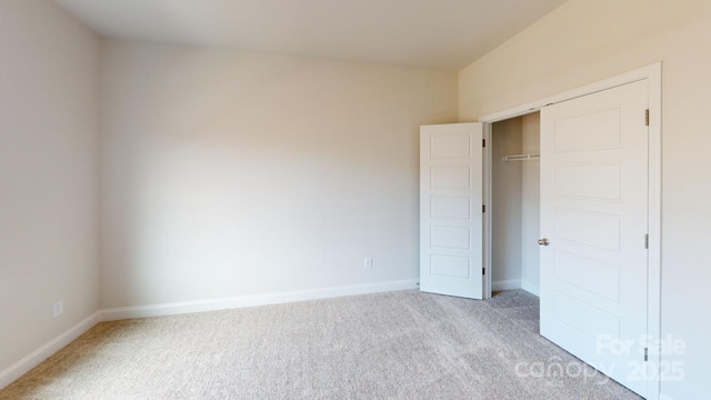 9601 Pointer Rd Unit 77, Huntersville, NC 28078 - unfurnished bedroom featuring light carpet and a closet