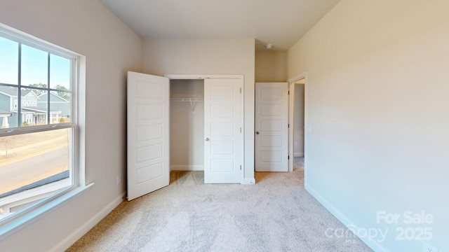 9601 Pointer Rd Unit 77, Huntersville, NC 28078 - unfurnished bedroom with light carpet and a closet