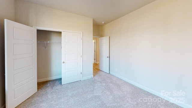 9601 Pointer Rd Unit 77, Huntersville, NC 28078 - unfurnished bedroom featuring a closet and light carpet