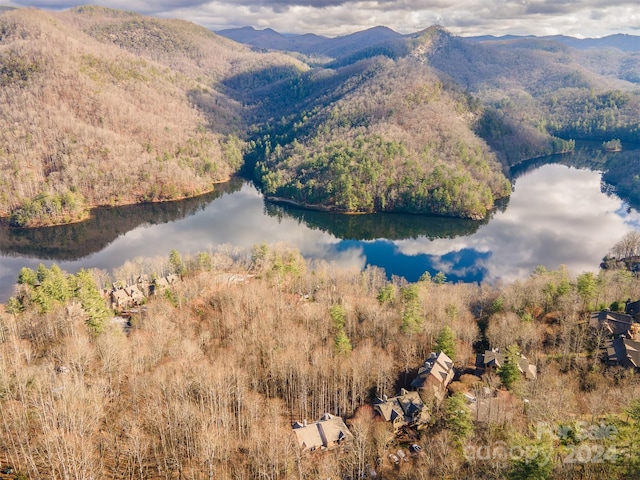 drone / aerial view featuring a water and mountain view