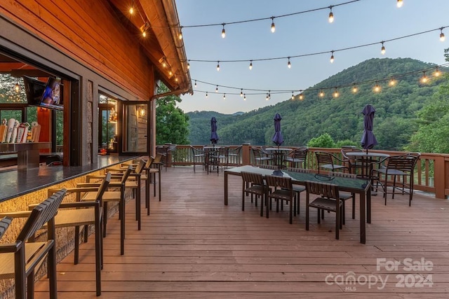 wooden terrace featuring a mountain view