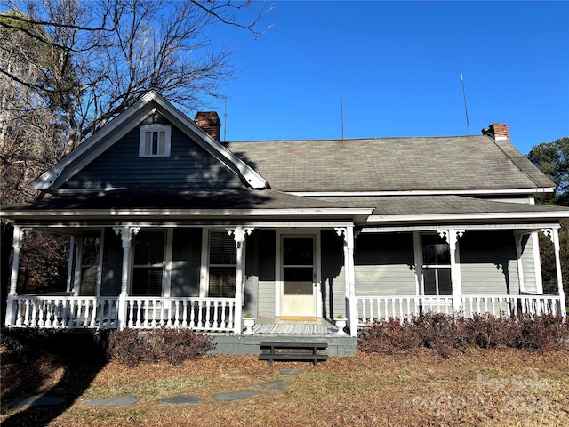 farmhouse-style home featuring a porch