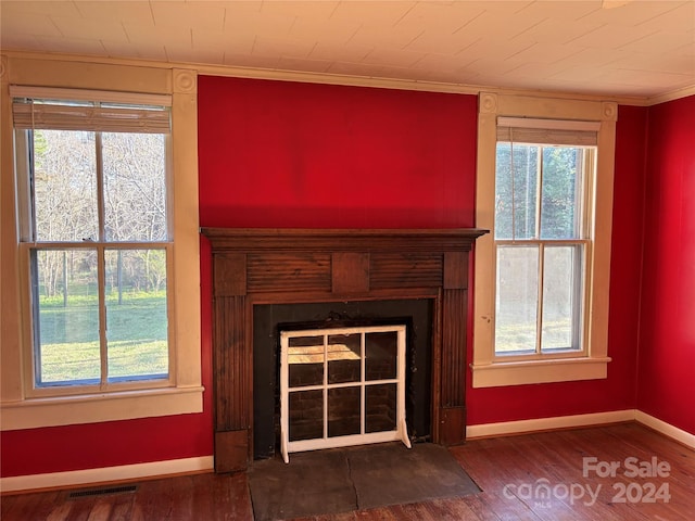 interior details with wood-type flooring and ornamental molding