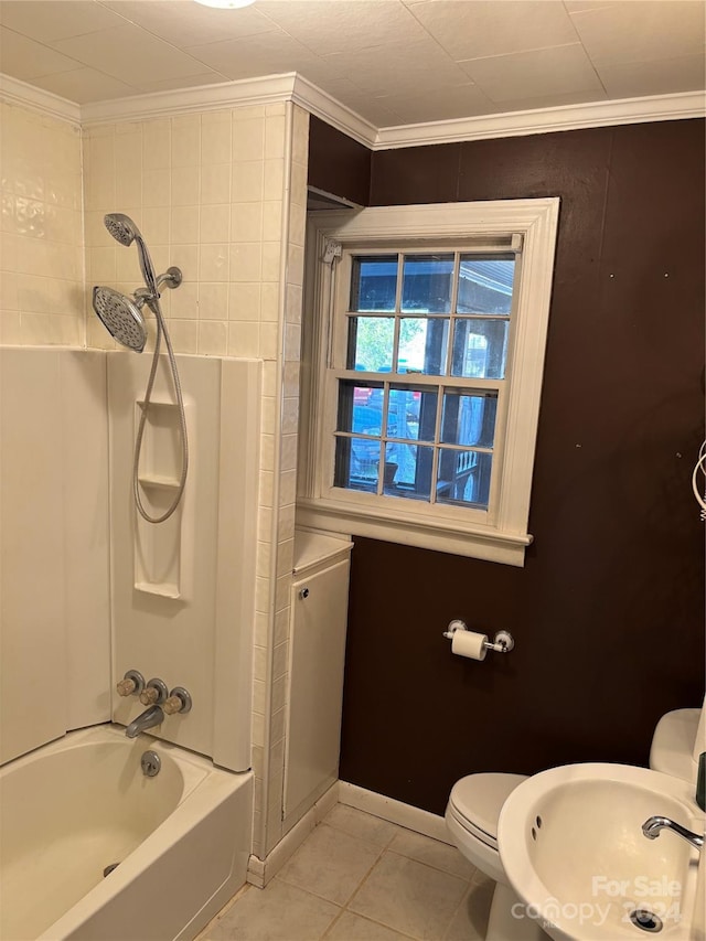 full bathroom featuring tile patterned flooring, tub / shower combination, crown molding, and sink