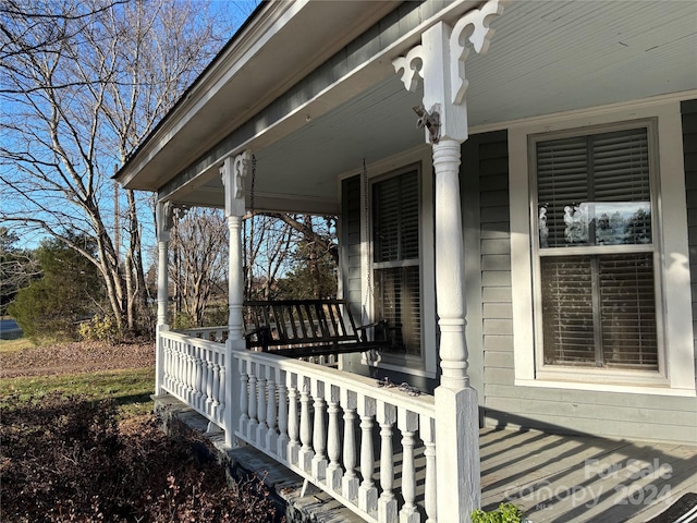 wooden terrace featuring a porch