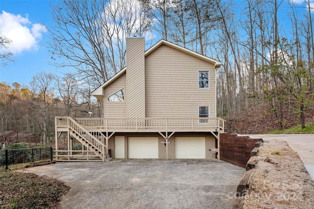 view of side of home featuring a garage