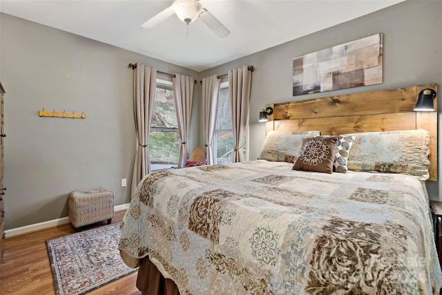 bedroom with hardwood / wood-style flooring and ceiling fan