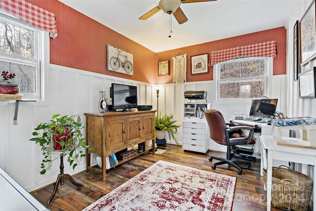 office with ceiling fan and dark wood-type flooring