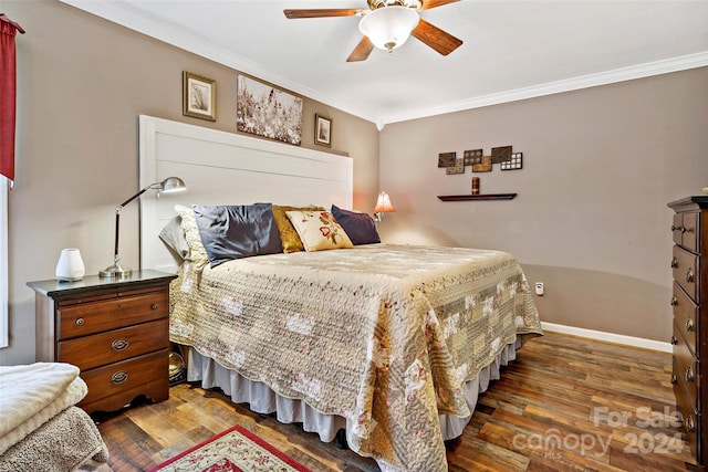 bedroom featuring crown molding, ceiling fan, and dark wood-type flooring