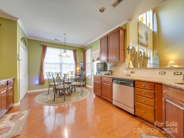 kitchen featuring decorative backsplash, stainless steel dishwasher, decorative light fixtures, and light wood-type flooring