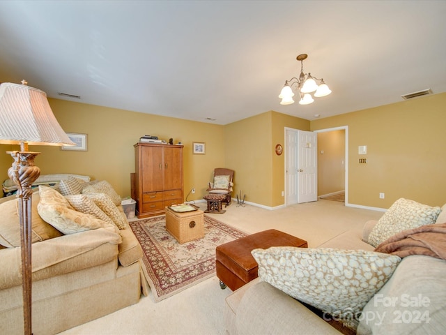 living room with light colored carpet and a chandelier