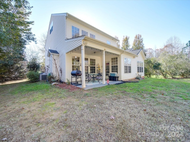 back of property with a patio, central AC, ceiling fan, and a lawn