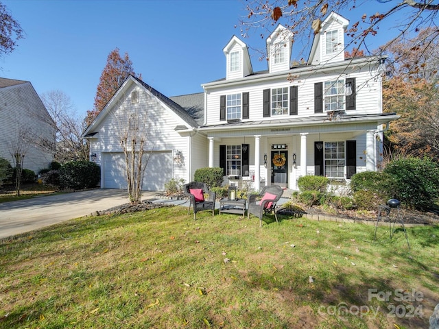 view of front facade featuring a front yard and a garage