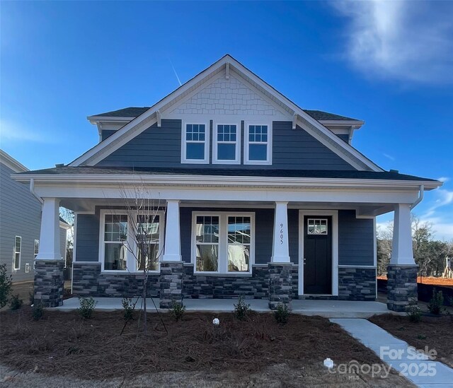 craftsman-style home with covered porch