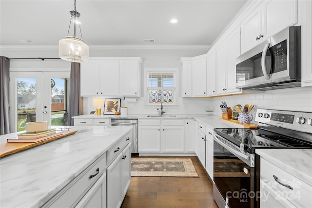 kitchen featuring white cabinetry, plenty of natural light, and appliances with stainless steel finishes