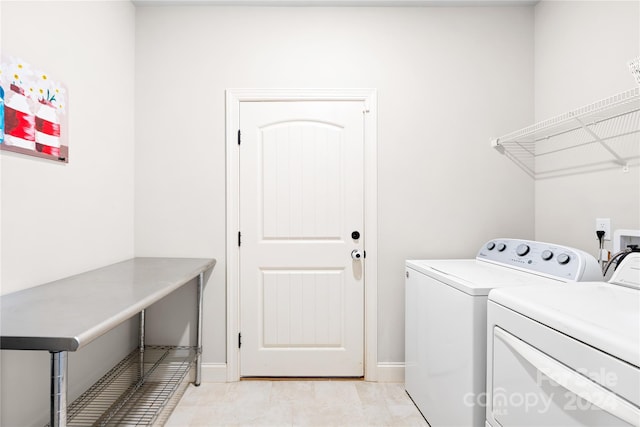 washroom with washing machine and dryer