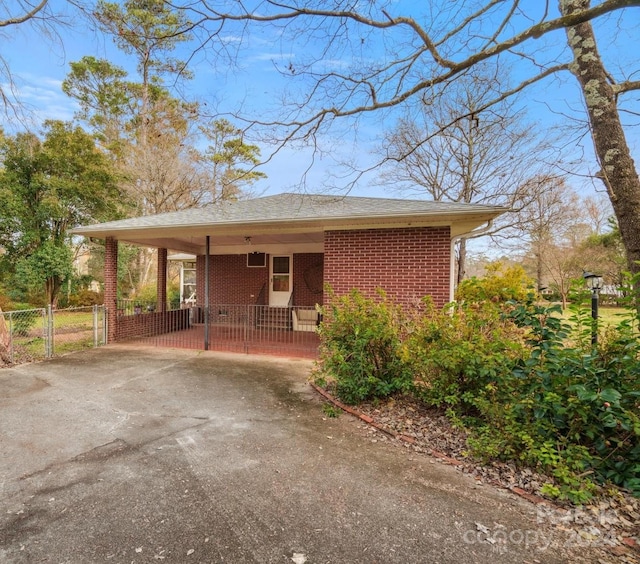 view of side of home featuring a carport