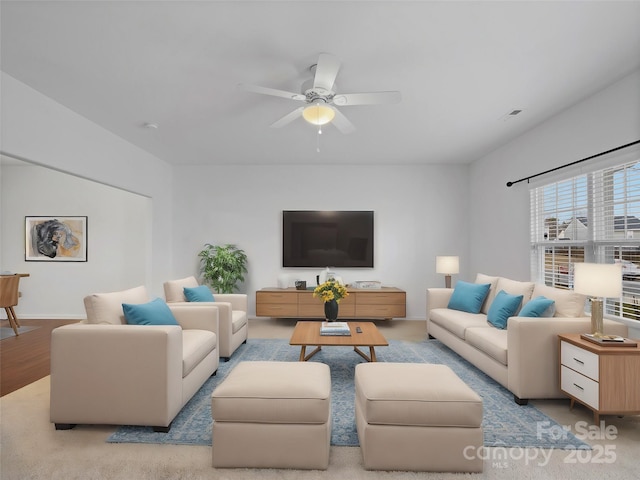 living room with ceiling fan and light hardwood / wood-style floors