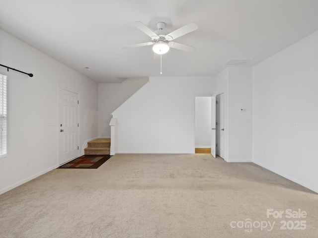 interior space with ceiling fan