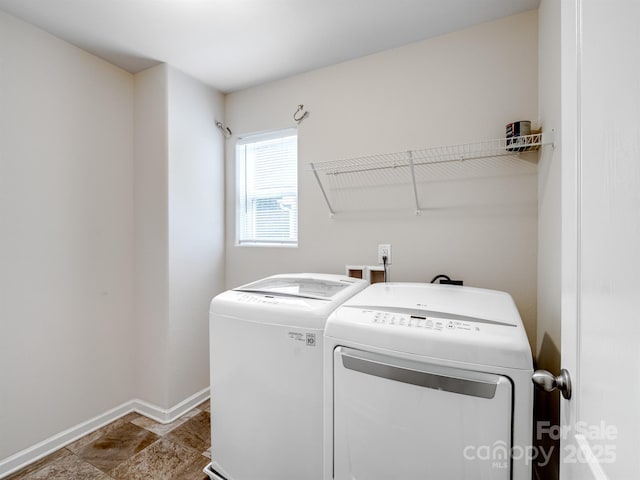 laundry room with independent washer and dryer