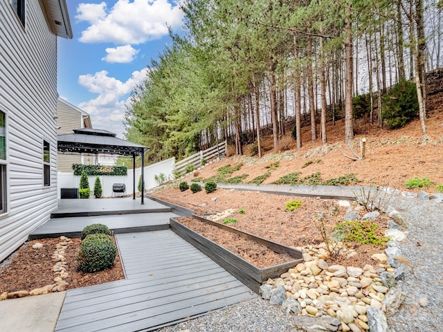 view of yard featuring a gazebo and a deck