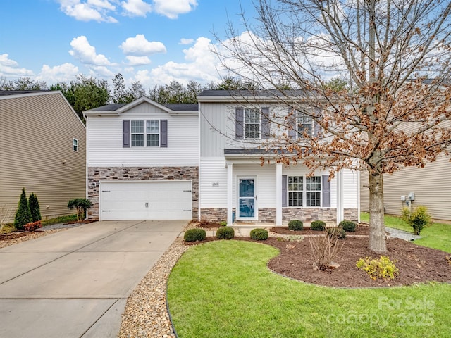 view of front of house featuring a garage and a front lawn